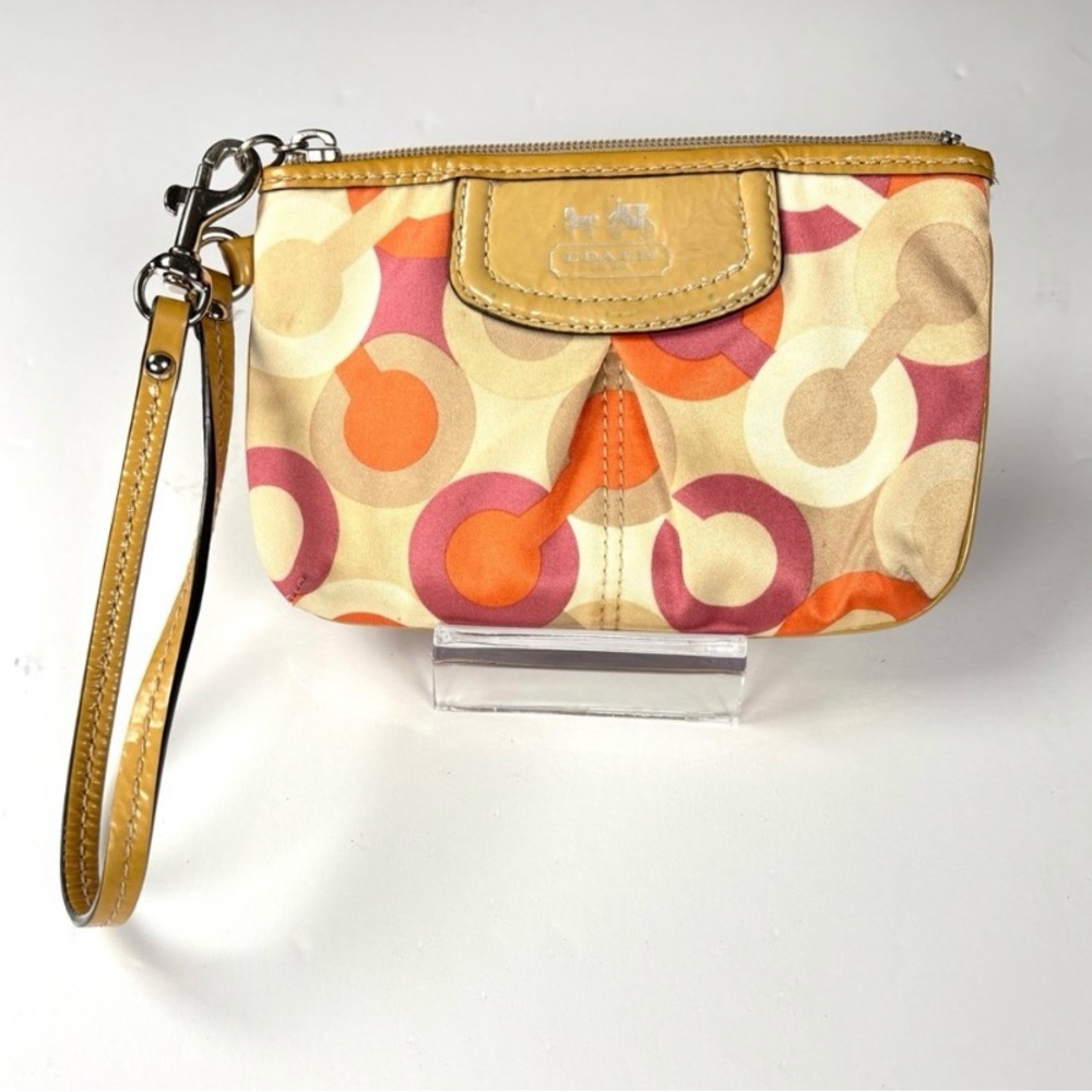 Coach Optic C Colorful Patterned Wristlet
Orange pink cream. Patent Leather